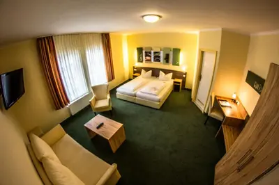 Ein Bett oder Betten in einem Zimmer der Unterkunft Gästehaus Blaue Ecke