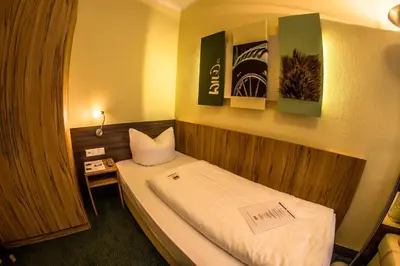 Ein Bett oder Betten in einem Zimmer der Unterkunft Gästehaus Blaue Ecke