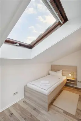 Ein Bett oder Betten in einem Zimmer der Unterkunft Gästehaus Blaue Ecke
