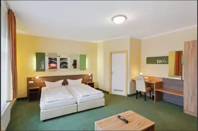 Ein Bett oder Betten in einem Zimmer der Unterkunft Gästehaus Blaue Ecke