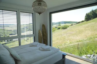 Ein Bett oder Betten in einem Zimmer der Unterkunft Ferienhaus zur Burg Olbruck