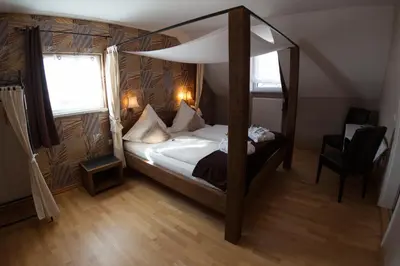 Ein Bett oder Betten in einem Zimmer der Unterkunft Dooscht Gästehaus Reichshof