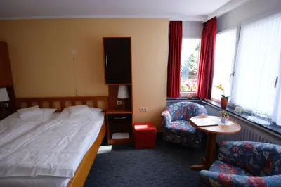 Ein Bett oder Betten in einem Zimmer der Unterkunft Bertricher Hof Hotel Garni