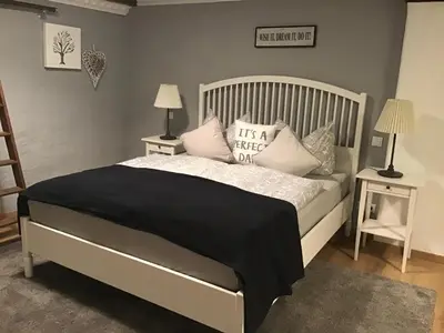Ein Bett oder Betten in einem Zimmer der Unterkunft Alter Winzerhof