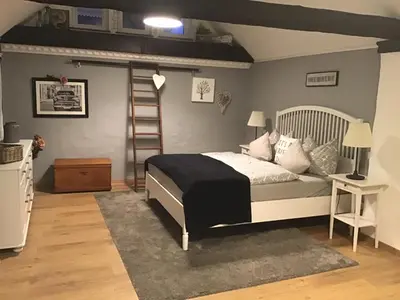 Ein Bett oder Betten in einem Zimmer der Unterkunft Alter Winzerhof