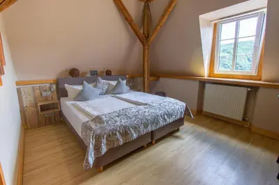Ein Bett oder Betten in einem Zimmer der Unterkunft Weinhof Gassen