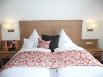 Ein Bett oder Betten in einem Zimmer der Unterkunft Hotel Garni Rheinpracht