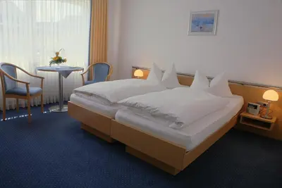 Ein Bett oder Betten in einem Zimmer der Unterkunft Hotel Retterath am Nürburgring