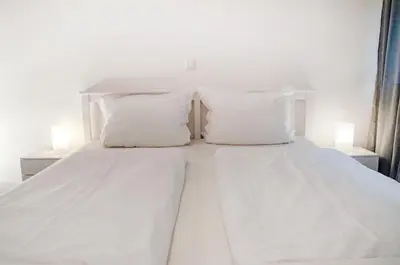 Ein Bett oder Betten in einem Zimmer der Unterkunft Ferienwohnungen Lithos