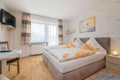 Ein Bett oder Betten in einem Zimmer der Unterkunft Landhaus Heimisch Bed & Breakfast