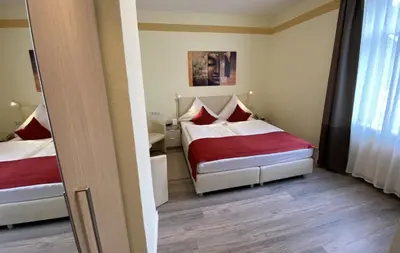 Ein Bett oder Betten in einem Zimmer der Unterkunft Gasthaus Pension Moselgruss