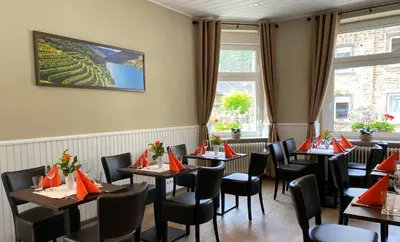 Ein Sitzbereich in der Unterkunft Gasthaus Pension Moselgruss