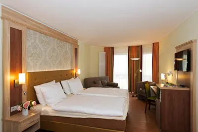 Ein Bett oder Betten in einem Zimmer der Unterkunft Rheinhotel Larus