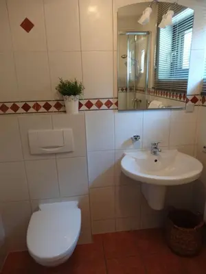 Ein Badezimmer in der Unterkunft Stadt und Wald