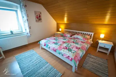 Ein Bett oder Betten in einem Zimmer der Unterkunft Quilt Inn