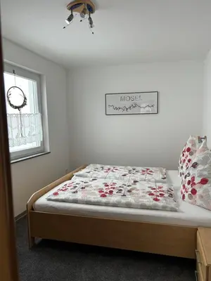 Ein Bett oder Betten in einem Zimmer der Unterkunft Haus Ostermann