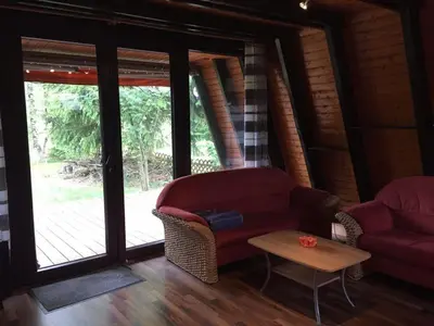 Ein Sitzbereich in der Unterkunft Familienfreundliches Ferienhaus mit Waldrand Lage