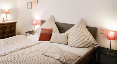 Ein Bett oder Betten in einem Zimmer der Unterkunft Ferienwohnung Weis