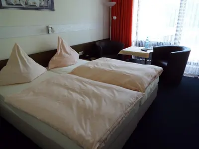 Ein Bett oder Betten in einem Zimmer der Unterkunft Park-Hotel