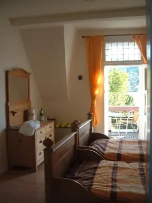 Ein Bett oder Betten in einem Zimmer der Unterkunft Wohnen im Burghotel