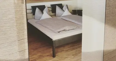 Ein Bett oder Betten in einem Zimmer der Unterkunft Ferienwohnung Funk