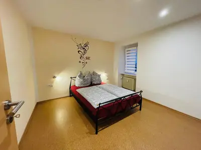 Ein Bett oder Betten in einem Zimmer der Unterkunft Ferienweingut Reh in Klüsserath