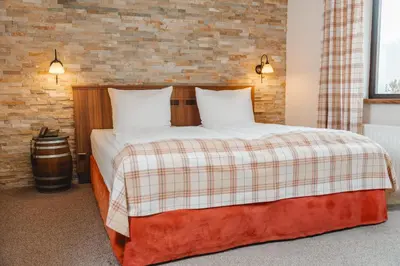 Ein Bett oder Betten in einem Zimmer der Unterkunft Hotel Lellmann