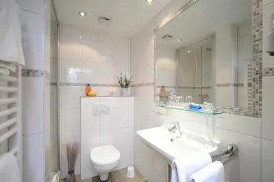 Ein Badezimmer in der Unterkunft Hotel Lellmann