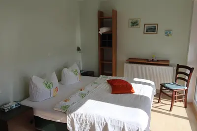 Ein Bett oder Betten in einem Zimmer der Unterkunft Gastehaus Weingut Rossler