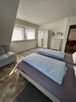 Ein Bett oder Betten in einem Zimmer der Unterkunft Haus Rheinterrasse