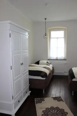 Ein Bett oder Betten in einem Zimmer der Unterkunft Ferienwohnung Westwind
