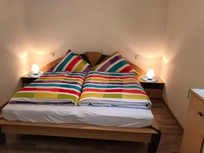 Ein Bett oder Betten in einem Zimmer der Unterkunft Winzerschenke