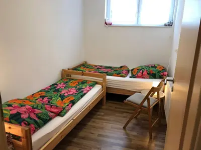 Ein Bett oder Betten in einem Zimmer der Unterkunft Winzerschenke