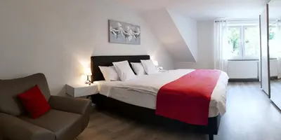 Ein Bett oder Betten in einem Zimmer der Unterkunft Ferienwohnung Brautrock