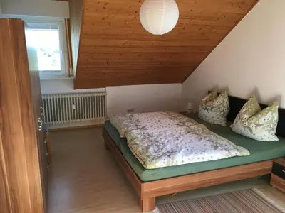 Ein Bett oder Betten in einem Zimmer der Unterkunft Ferienwohnungen Hehner
