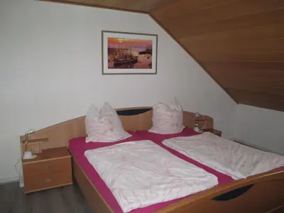 Ein Bett oder Betten in einem Zimmer der Unterkunft Ferienwohnungen Hehner
