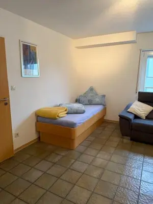 Ein Bett oder Betten in einem Zimmer der Unterkunft FEWO Schmandin Laacher See