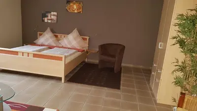Ein Bett oder Betten in einem Zimmer der Unterkunft Ferienwohnung Tetzlaff