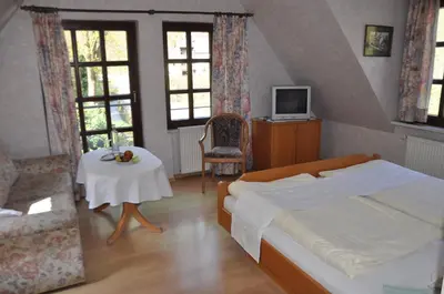 Ein Bett oder Betten in einem Zimmer der Unterkunft Gutsschänke Sennerhof