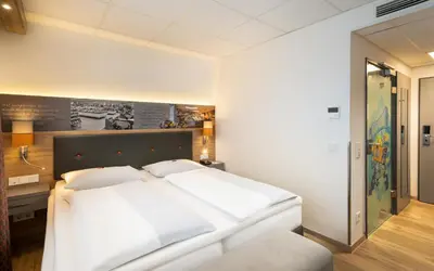 Ein Bett oder Betten in einem Zimmer der Unterkunft Food Hotel