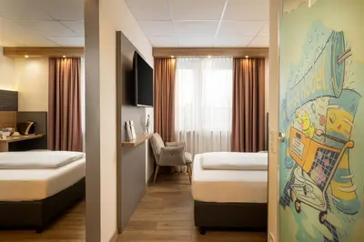 Ein Bett oder Betten in einem Zimmer der Unterkunft Food Hotel