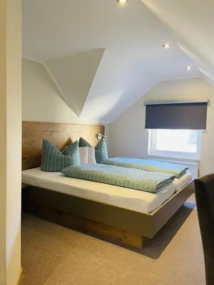 Ein Bett oder Betten in einem Zimmer der Unterkunft Weinbergs Loge