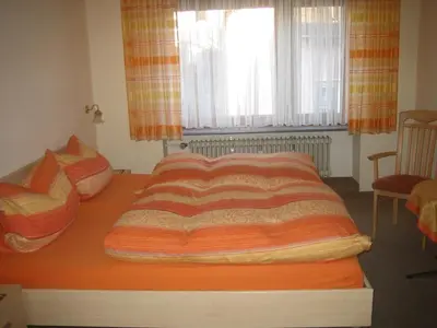 Ein Bett oder Betten in einem Zimmer der Unterkunft Gästehaus Kiesgen-Mendgen