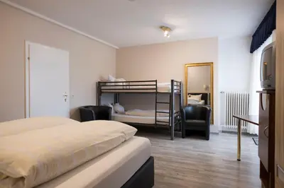 Ein Bett oder Betten in einem Zimmer der Unterkunft Landgasthaus Blick ins Tal