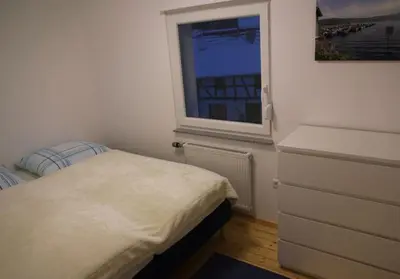 Ein Bett oder Betten in einem Zimmer der Unterkunft Ferienhaus am Kreuzberg - Nürburgring