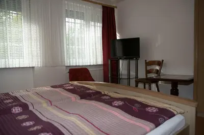 Ein Bett oder Betten in einem Zimmer der Unterkunft Alte Winzerschenke