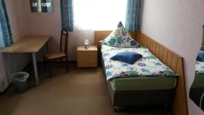 Ein Bett oder Betten in einem Zimmer der Unterkunft Hotel Andernacher Hof