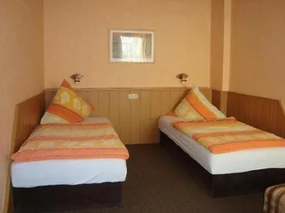 Ein Bett oder Betten in einem Zimmer der Unterkunft Hotel Andernacher Hof