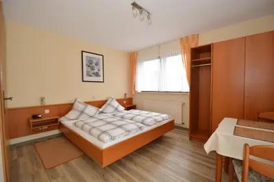 Ein Bett oder Betten in einem Zimmer der Unterkunft Weingut***Pension Günther Scholtes