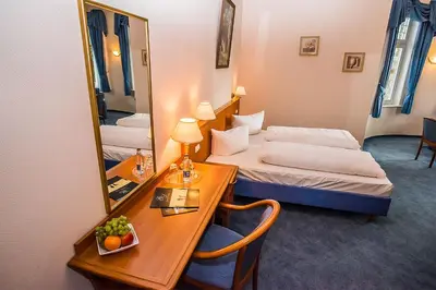 Ein Bett oder Betten in einem Zimmer der Unterkunft Golfhotel Denzerheide